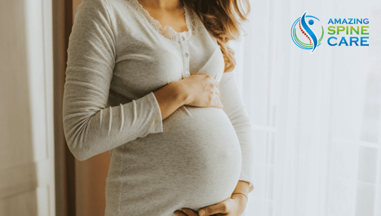 Pregnant woman holding her belly