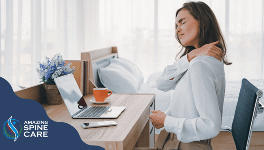 woman with neck pain at work