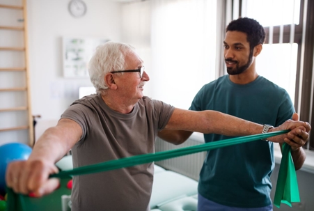A patient and physical therapist during a physical therapy session