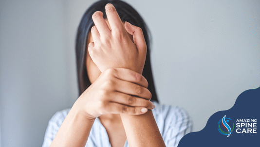 A woman holding her wrist