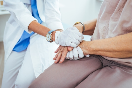 Closeup shot of a nurse holding a patient's hand in comfort. Healthcare worker giving support and love to a patient. Cropped shot of a female nurse hold her senior patient's hand