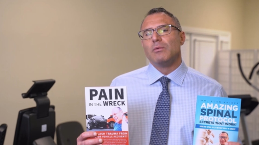 Dr. Kieger holding flyers